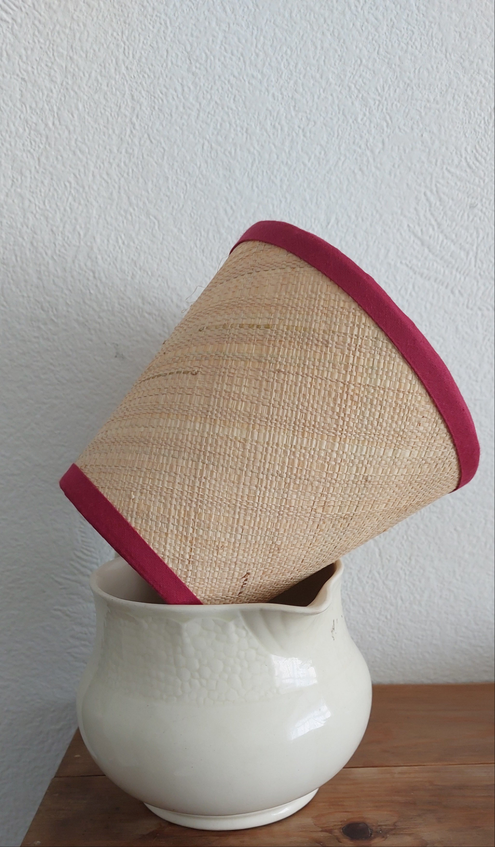 Raffia Candle Clip Lampshade with red trim.