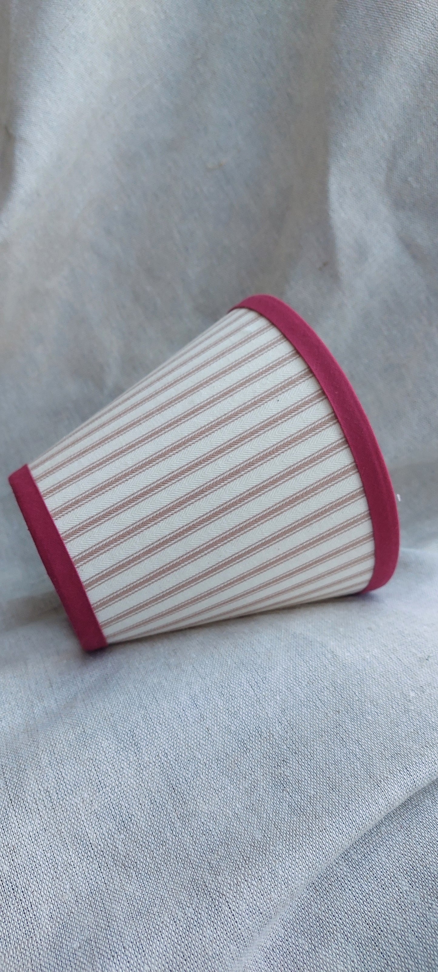 Iaan Mankin candle clip lampshade with red trim beige